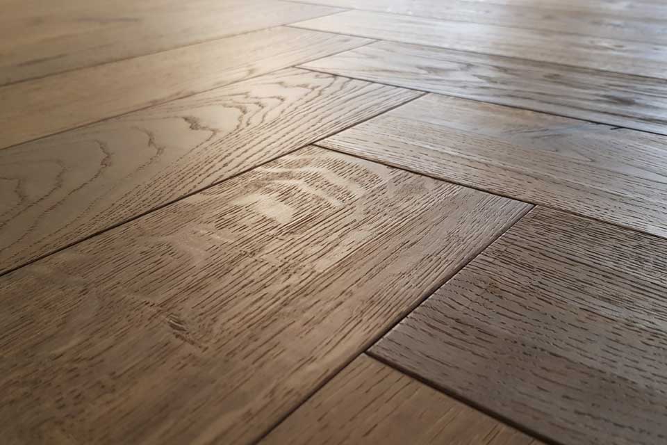 Woodline Parquetry Fischgrät-Parkett Eiche Salzburg Nahaufnahe